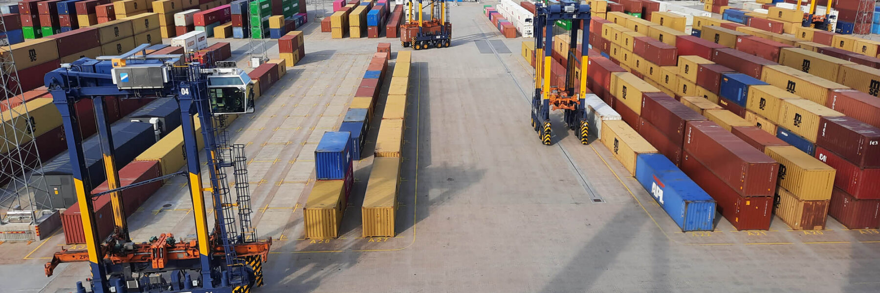 View of container yard with straddlers in use at Hutchison Ports Stockholm