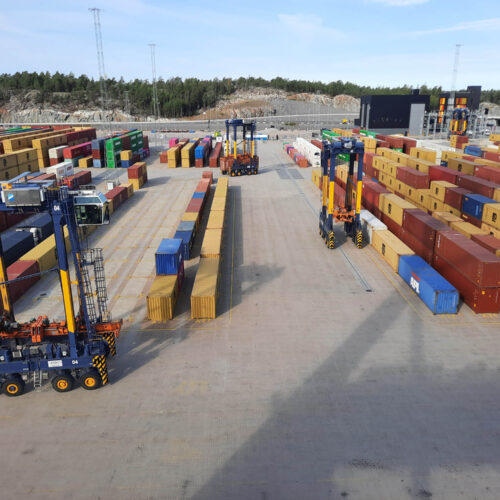 View of container yard with straddlers in use at Hutchison Ports Stockholm