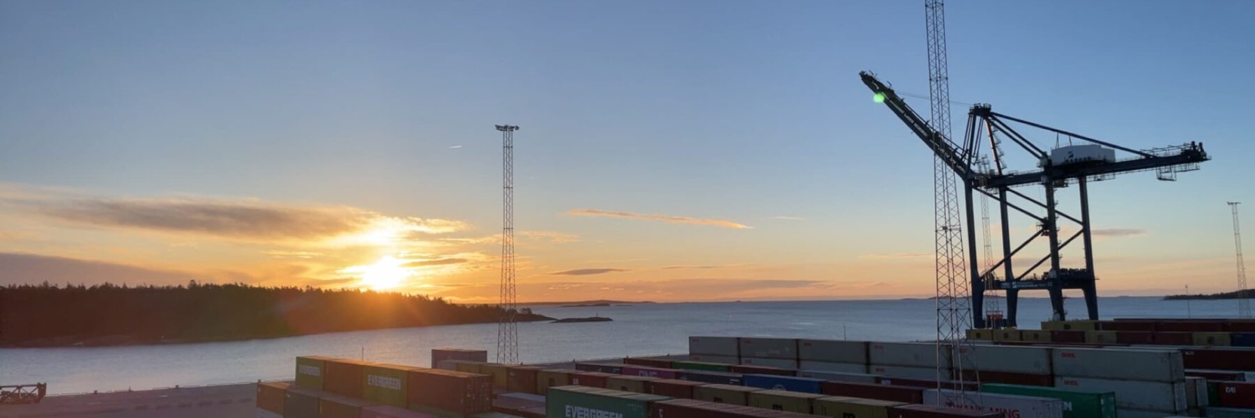 View of Hutchison Ports Stockholm Quay Side at sunset